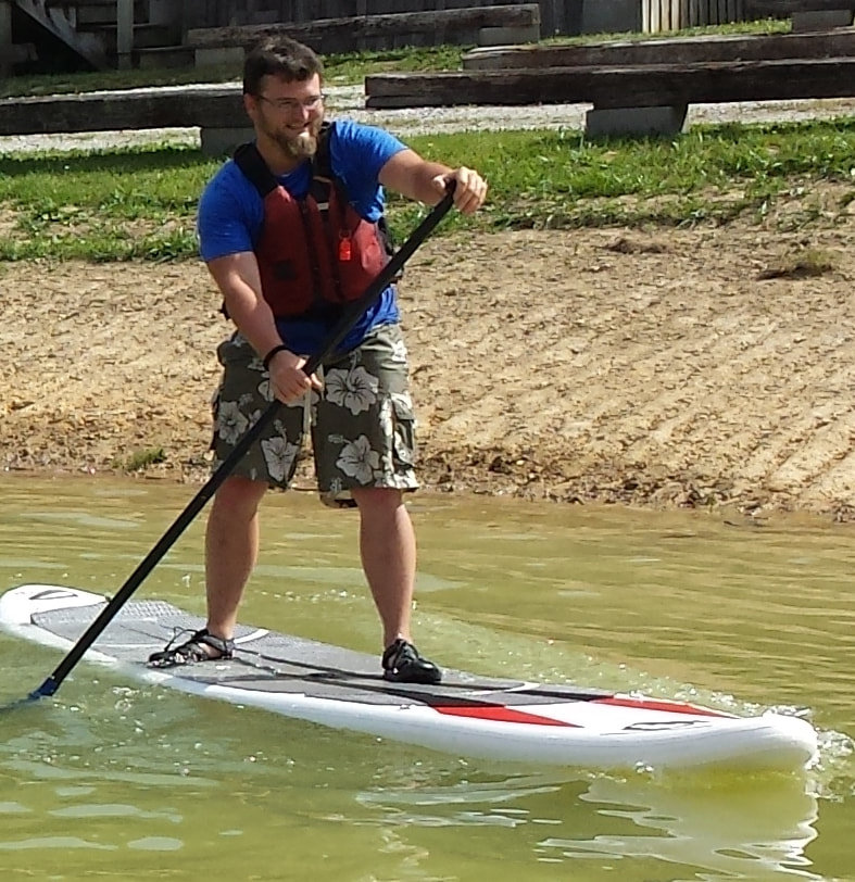 Man on Stand Up Paddle board (SUP)