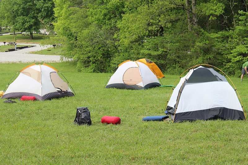 Several tents are seen spread out among our field camping area during our summer season.