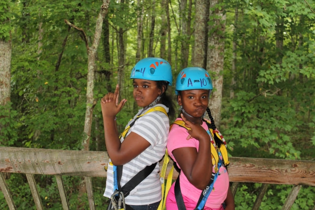 Two girls on zip tower
