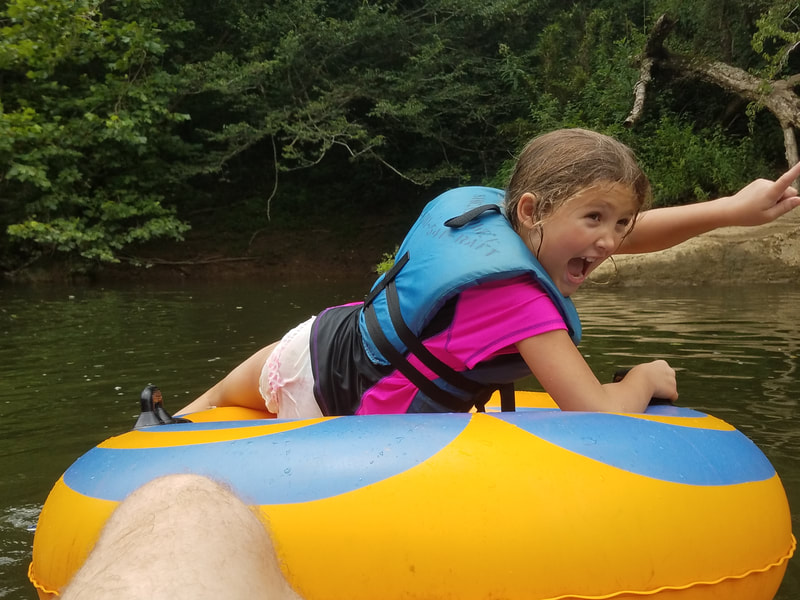 Happy Girl tubing on the Big South Fork River