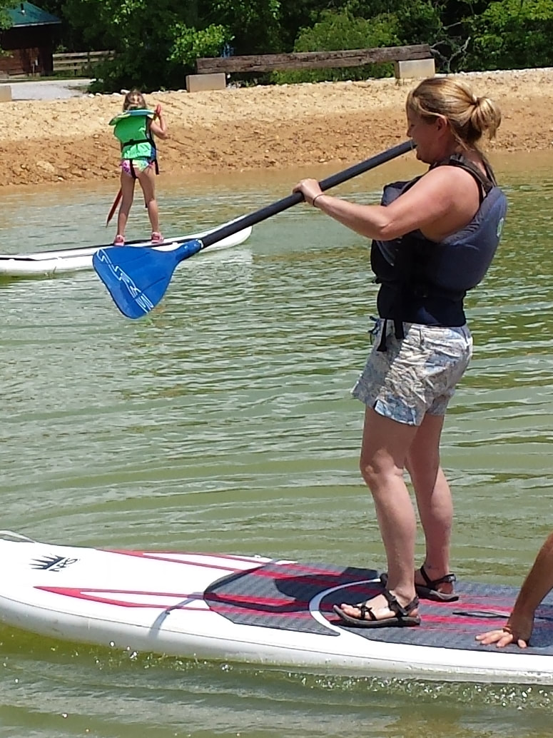 Woman on stand up paddle board (SUP)
