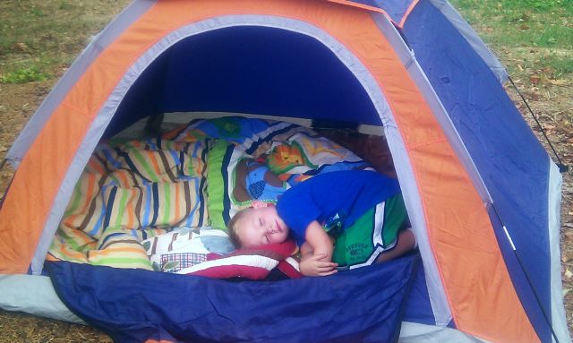 Boy sleeping in tent