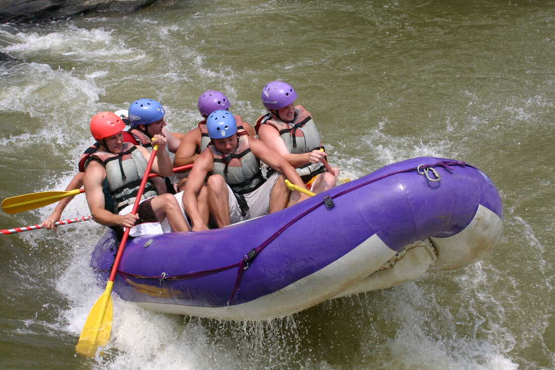 group in whitewater raft