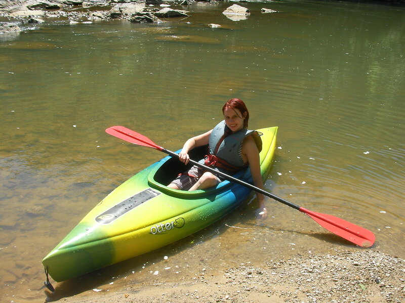woman in kayak near shore