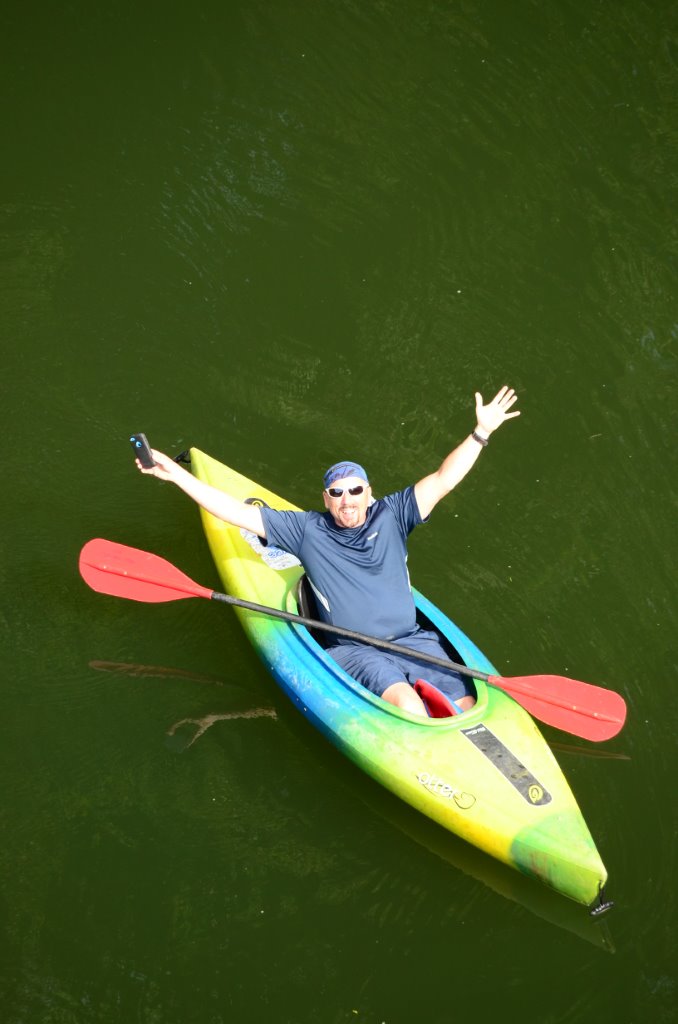 Happy man in solo kayak